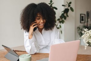 Woman on phone discussing SEO strategies for Connecticut businesses and online presence.