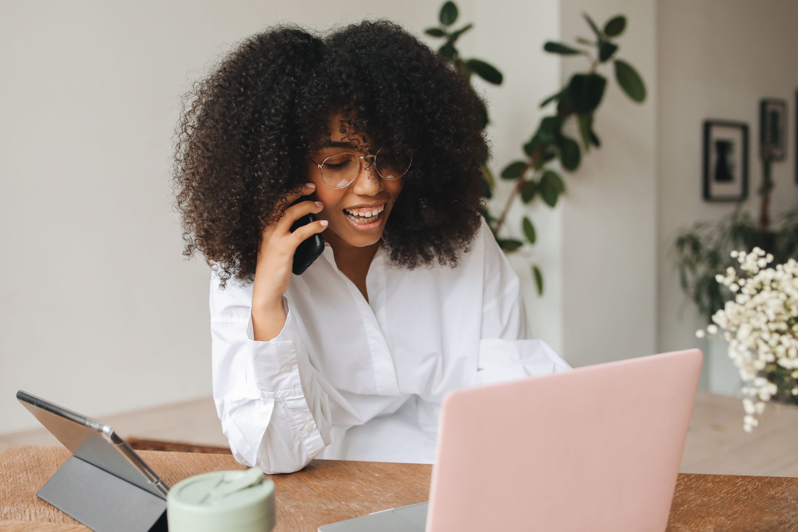 Woman on phone discussing SEO strategies for Connecticut businesses and online presence.